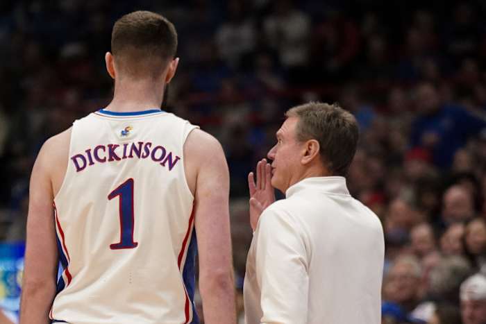 Jan 22, 2024; Lawrence, Kansas, USA; Kansas Jayhawks center Hunter Dickinson (1) talks with head coach Bill Self against the Cincinnati Bearcats during the first half at Allen Fieldhouse.